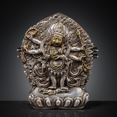 Lot 308 - A PARCEL-GILT SILVER REPOUSSÉ GAU DEPICTING SHADBHUJA MAHAKALA, BHUTAN, 19TH CENTURY