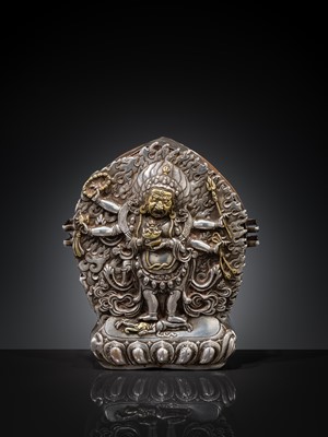 Lot 308 - A PARCEL-GILT SILVER REPOUSSÉ GAU DEPICTING SHADBHUJA MAHAKALA, BHUTAN, 19TH CENTURY