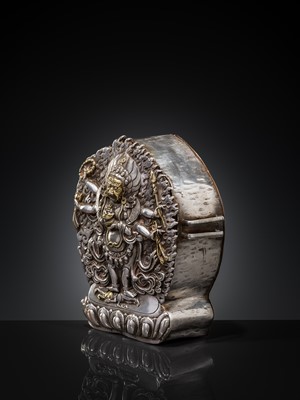 Lot 308 - A PARCEL-GILT SILVER REPOUSSÉ GAU DEPICTING SHADBHUJA MAHAKALA, BHUTAN, 19TH CENTURY