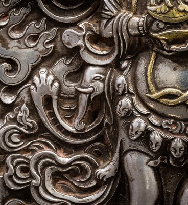 Lot 308 - A PARCEL-GILT SILVER REPOUSSÉ GAU DEPICTING SHADBHUJA MAHAKALA, BHUTAN, 19TH CENTURY