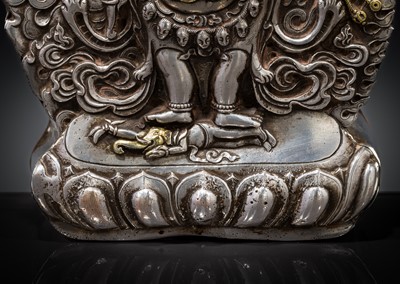 Lot 308 - A PARCEL-GILT SILVER REPOUSSÉ GAU DEPICTING SHADBHUJA MAHAKALA, BHUTAN, 19TH CENTURY