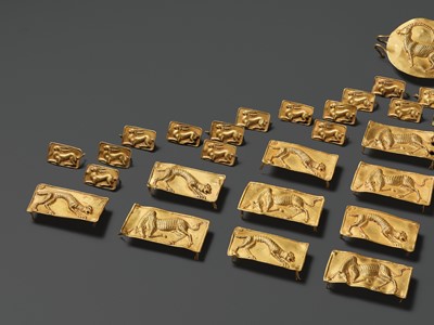 Lot 83 - A COMPLETE BELT SET OF FORTY-FOUR GOLD REPOUSSÉ PLAQUES, ACHAEMENID EMPIRE, PERSIA, 7TH-5TH CENTURY BC