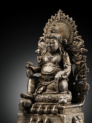 Lot 472 - A SILVER FIGURE OF JAMBHALA, LATE MAJAPAHIT PERIOD