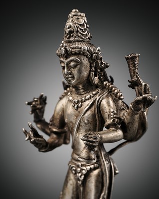 Lot 666 - A SILVER FIGURE OF SIX-ARMED LOKESHVARA, CENTRAL JAVA, 9TH-10TH CENTURY