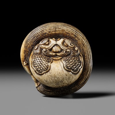 Lot 329 - KO: A FINE ANTLER NETSUKE OF A MOKUGYO AND HOSSU