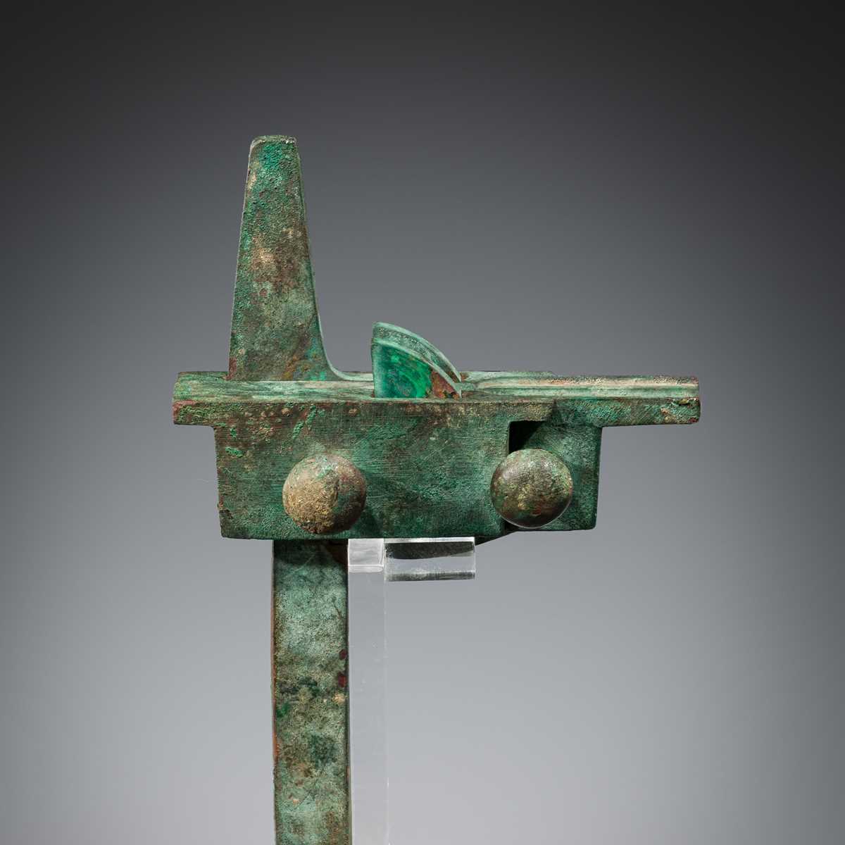 Lot 81 - AN ARCHAIC BRONZE CROSSBOW TRIGGER MECHANISM,