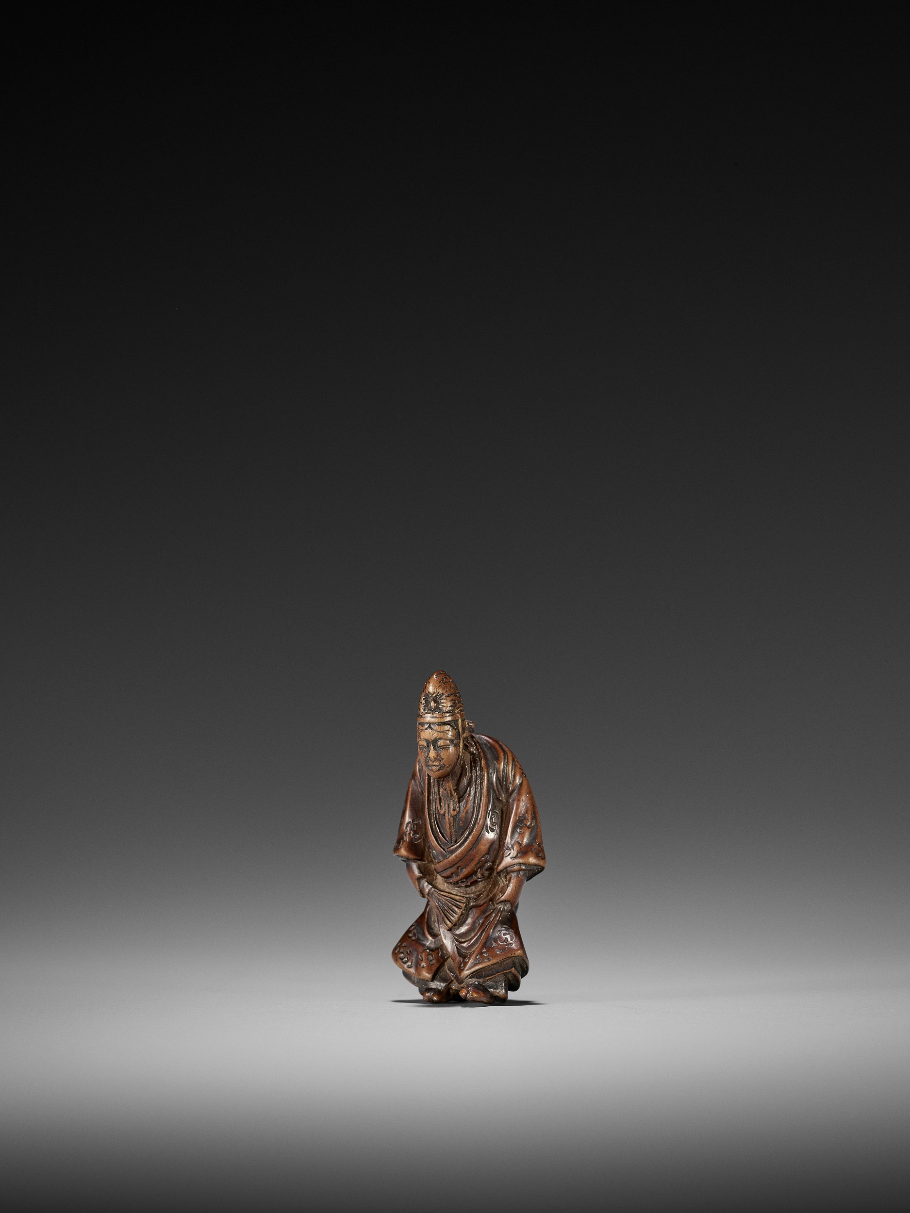 Lot 147 - GESSHO: AN EARLY EDO SCHOOL WOOD NETSUKE OF