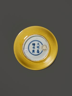 Lot 149 - A SMALL IMPERIAL YELLOW-GLAZED DISH, JIAJING MARK AND PERIOD, 1521-1567