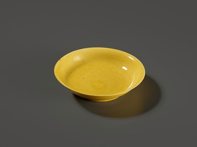 Lot 149 - A SMALL IMPERIAL YELLOW-GLAZED DISH, JIAJING MARK AND PERIOD, 1521-1567