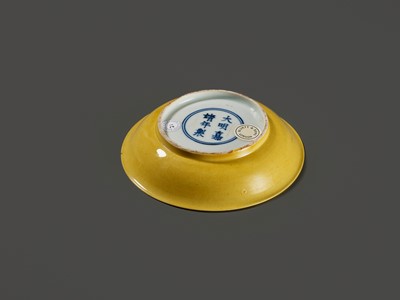 Lot 149 - A SMALL IMPERIAL YELLOW-GLAZED DISH, JIAJING MARK AND PERIOD, 1521-1567