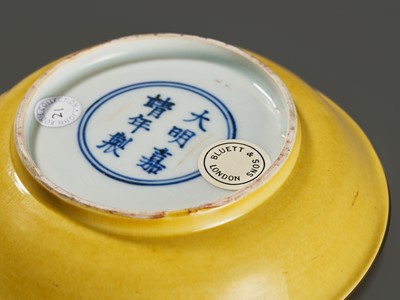 Lot 149 - A SMALL IMPERIAL YELLOW-GLAZED DISH, JIAJING MARK AND PERIOD, 1521-1567