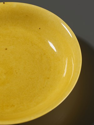 Lot 149 - A SMALL IMPERIAL YELLOW-GLAZED DISH, JIAJING MARK AND PERIOD, 1521-1567
