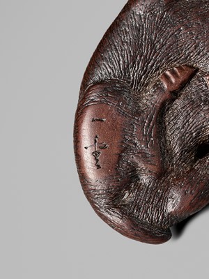 Lot 145 - ICHIUN: A FINE WOOD NETSUKE OF A RECUMBENT BOAR