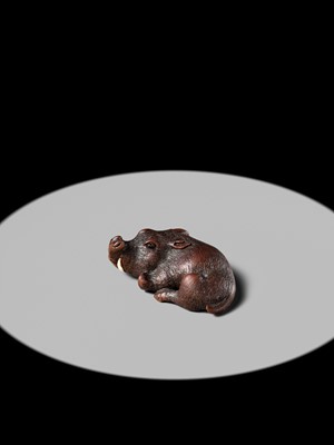 Lot 145 - ICHIUN: A FINE WOOD NETSUKE OF A RECUMBENT BOAR