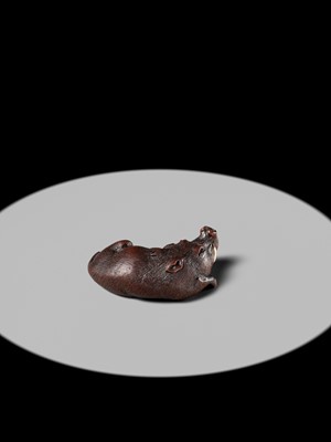 Lot 145 - ICHIUN: A FINE WOOD NETSUKE OF A RECUMBENT BOAR