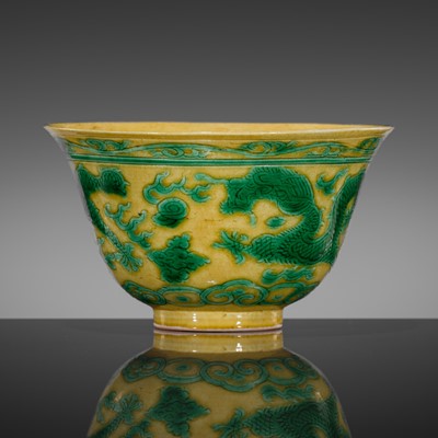 Lot 559 - A YELLOW AND GREEN-ENAMELED INCISED 'DRAGON' BOWL, KANGXI MARK AND PERIOD