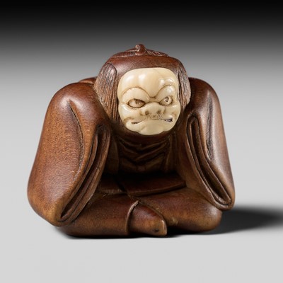 Lot 497 - HOICHI: A FINE INLAID WOOD NETSUKE OF A KARAKO WITH A BUAKU MASK