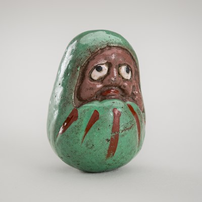 Lot 1229 - A LACQUERED PORCELAIN NETSUKE OF A DARUMA DOLL