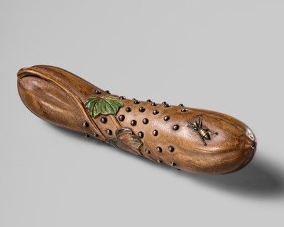 Lot 265 - AKASHI: A RARE INLAID WOOD NETSUKE OF A HECHIMA (SPONGE CUCUMBER)