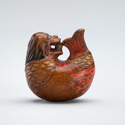 A LACQUERED WOOD NETSUKE OF A MOKUGYO