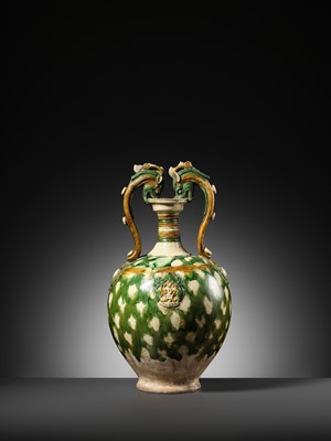 Lot 137 - A SANCAI-GLAZED APPLIQUÉ-DECORATED DRAGON-HANDLED AMPHORA, TANG DYNASTY