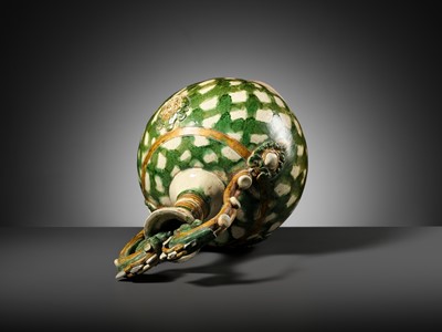 Lot 137 - A SANCAI-GLAZED APPLIQUÉ-DECORATED DRAGON-HANDLED AMPHORA, TANG DYNASTY