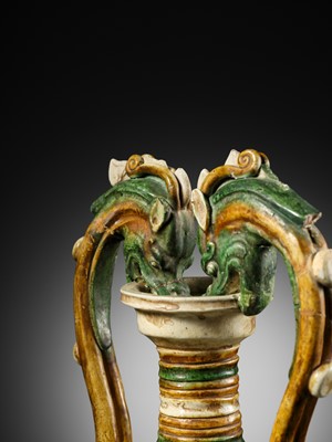 Lot 137 - A SANCAI-GLAZED APPLIQUÉ-DECORATED DRAGON-HANDLED AMPHORA, TANG DYNASTY