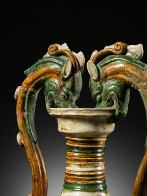 Lot 137 - A SANCAI-GLAZED APPLIQUÉ-DECORATED DRAGON-HANDLED AMPHORA, TANG DYNASTY