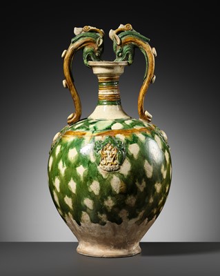 Lot 137 - A SANCAI-GLAZED APPLIQUÉ-DECORATED DRAGON-HANDLED AMPHORA, TANG DYNASTY