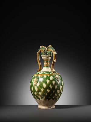Lot 137 - A SANCAI-GLAZED APPLIQUÉ-DECORATED DRAGON-HANDLED AMPHORA, TANG DYNASTY