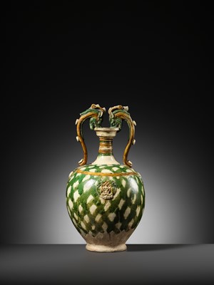 Lot 137 - A SANCAI-GLAZED APPLIQUÉ-DECORATED DRAGON-HANDLED AMPHORA, TANG DYNASTY
