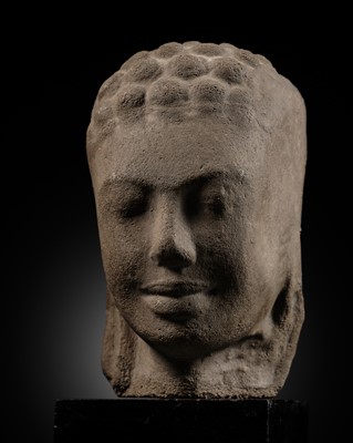 Lot 418 - A RARE AND UNUSUAL SANDSTONE HEAD OF BUDDHA, MON-DVARAVATI PERIOD, 7TH-9TH CENTURY