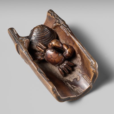 Lot 172 - HOKUTEI: A WOOD NETSUKE OF A CRAB AND A CLAM IN A SEGMENT OF BAMBOO