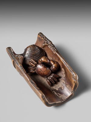 Lot 172 - HOKUTEI: A WOOD NETSUKE OF A CRAB AND A CLAM IN A SEGMENT OF BAMBOO