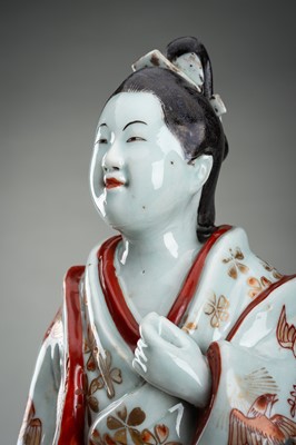 Lot 195 - AN IMARI PORCELAIN FIGURE OF A BIJIN
