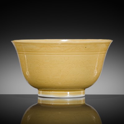 Lot 591 - A YELLOW-GLAZED AND INCISED 'DRAGONS' BOWL, GUANGXU MARK AND PERIOD