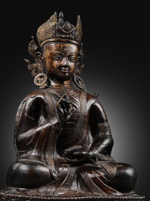 Lot 80 - A LARGE COPPER REPOUSSÉ FIGURE OF PADMASAMBHAVA, 17TH-18TH CENTURY