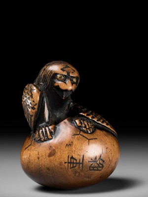 Lot 160 - SHIGEKATSU: A LARGE TANBA SCHOOL WOOD NETSUKE OF A HATCHING TENGU (TENGU NO TAMAGO)