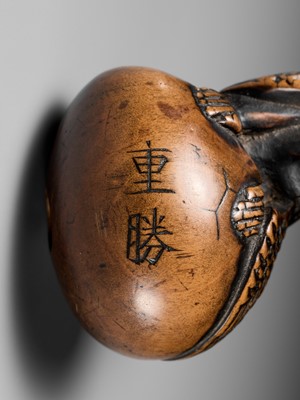 Lot 160 - SHIGEKATSU: A LARGE TANBA SCHOOL WOOD NETSUKE OF A HATCHING TENGU (TENGU NO TAMAGO)