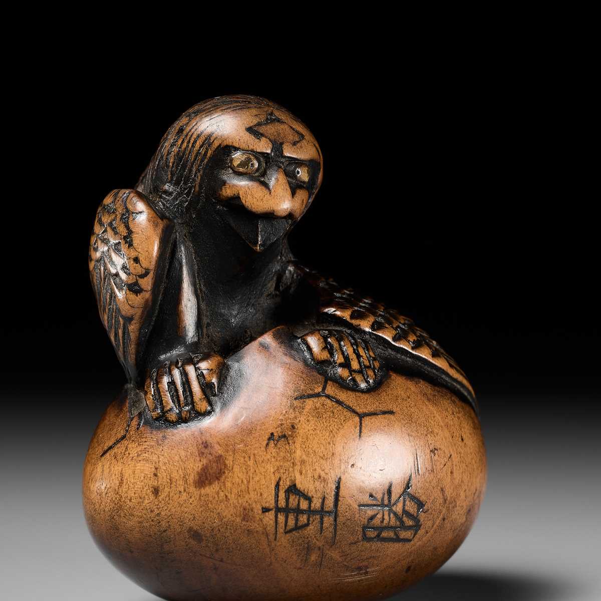 Lot 160 - SHIGEKATSU: A LARGE TANBA SCHOOL WOOD NETSUKE OF A HATCHING TENGU (TENGU NO TAMAGO)