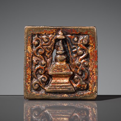 Lot 140 - A GILT-LACQUERED BRONZE SUTRA BUCKLE, TIBET, 13TH – 14TH CENTURY