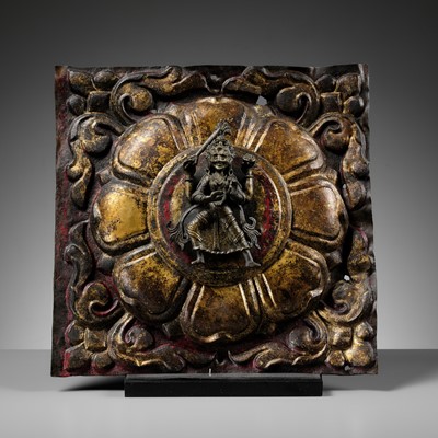 Lot 66 - A GILT-LACQUERED COPPER ALLOY REPOUSSÉ TEMPLE CEILING TILE WITH A CAST BRONZE FIGURE OF CHAMUNDI