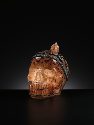 Lot 56 - A MONUMENTAL AND RARE ROCK CRYSTAL SKULL WEARING A GEMSTONE-INLAID GILT-METAL FILIGREE CROWN, 19TH TO FIRST HALF OF 20TH CENTURY