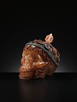 Lot 56 - A MONUMENTAL AND RARE ROCK CRYSTAL SKULL WEARING A GEMSTONE-INLAID GILT-METAL FILIGREE CROWN, 19TH TO FIRST HALF OF 20TH CENTURY