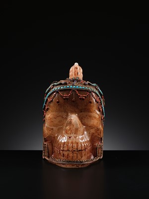 Lot 56 - A MONUMENTAL AND RARE ROCK CRYSTAL SKULL WEARING A GEMSTONE-INLAID GILT-METAL FILIGREE CROWN, 19TH TO FIRST HALF OF 20TH CENTURY