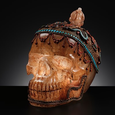 Lot 56 - A MONUMENTAL AND RARE ROCK CRYSTAL SKULL WEARING A GEMSTONE-INLAID GILT-METAL FILIGREE CROWN, 19TH TO FIRST HALF OF 20TH CENTURY