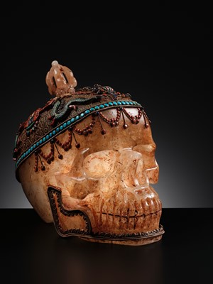 Lot 56 - A MONUMENTAL AND RARE ROCK CRYSTAL SKULL WEARING A GEMSTONE-INLAID GILT-METAL FILIGREE CROWN, 19TH TO FIRST HALF OF 20TH CENTURY