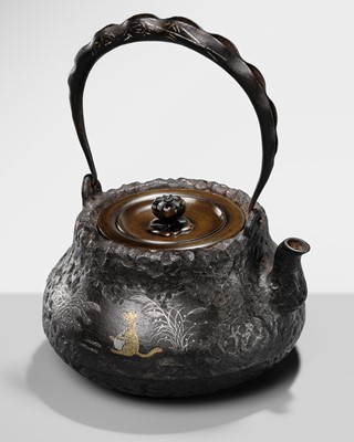 Lot 63 - RYUBUNDO: AN INLAID IRON TETSUBIN (TEA KETTLE) WITH A TANUKI BELLY-DRUMMING IN THE MOONLIGHT