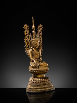 Lot 15 - A GILT-LACQUERED BRONZE FIGURE OF JAMBUPATI BUDDHA, SHAN STATES