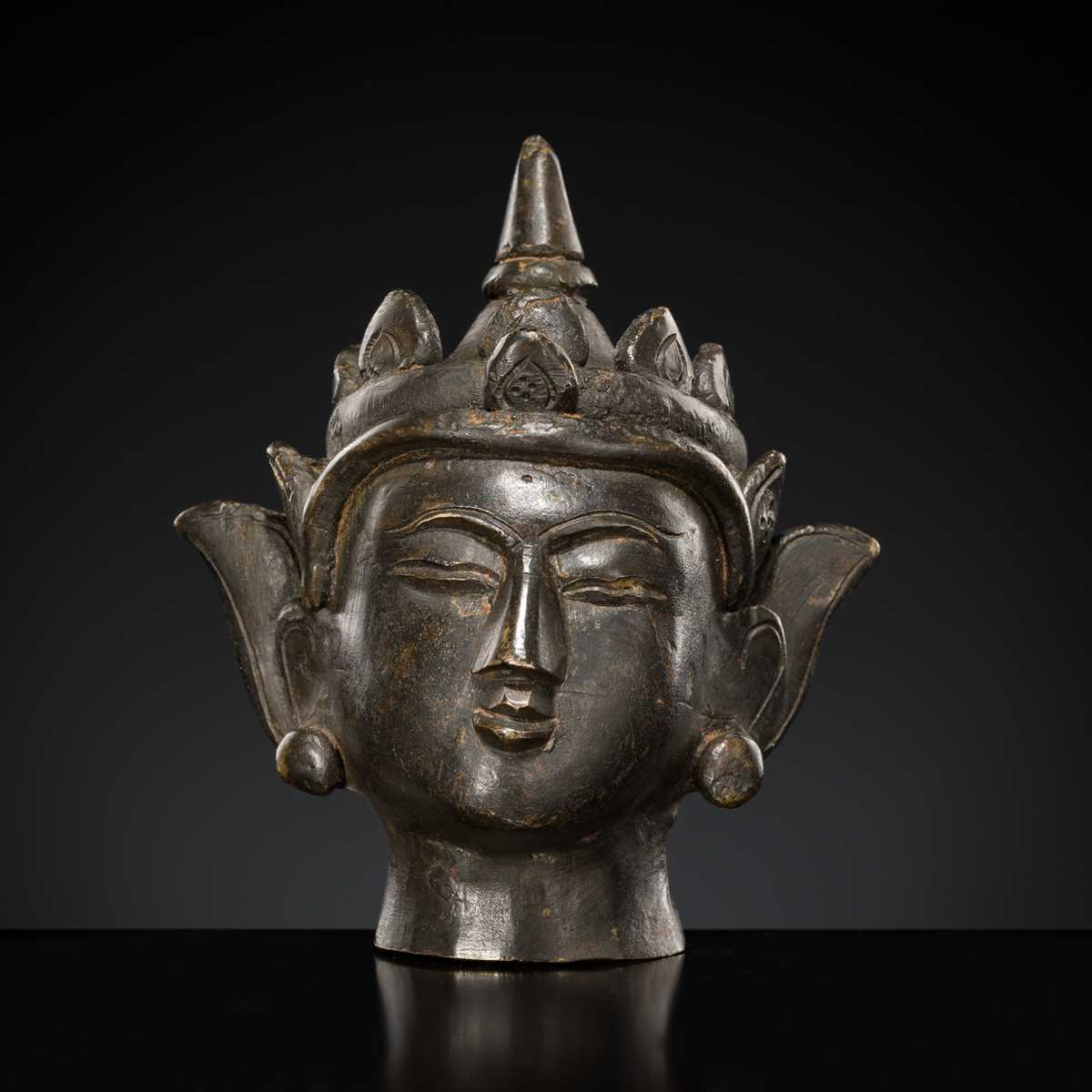 Lot 145 - A SMALL BRONZE HEAD OF CROWNED JAMBHUPATI BUDDHA, ARAKAN STYLE, 18TH-19TH CENTURY OR EARLIER